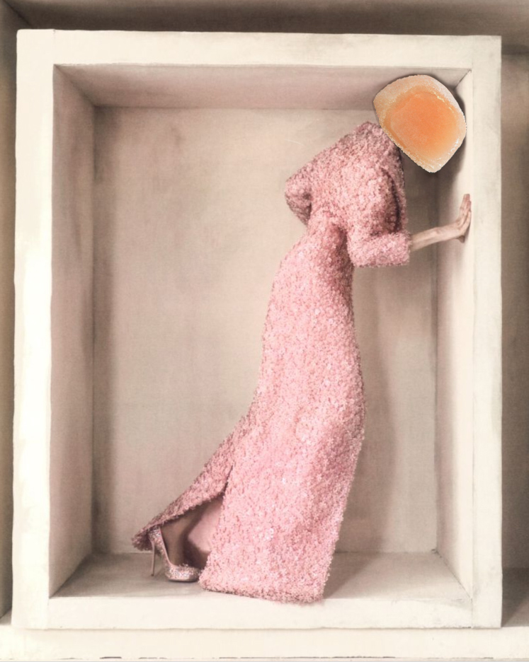 woman in pink dress and pumps leaning inside large box